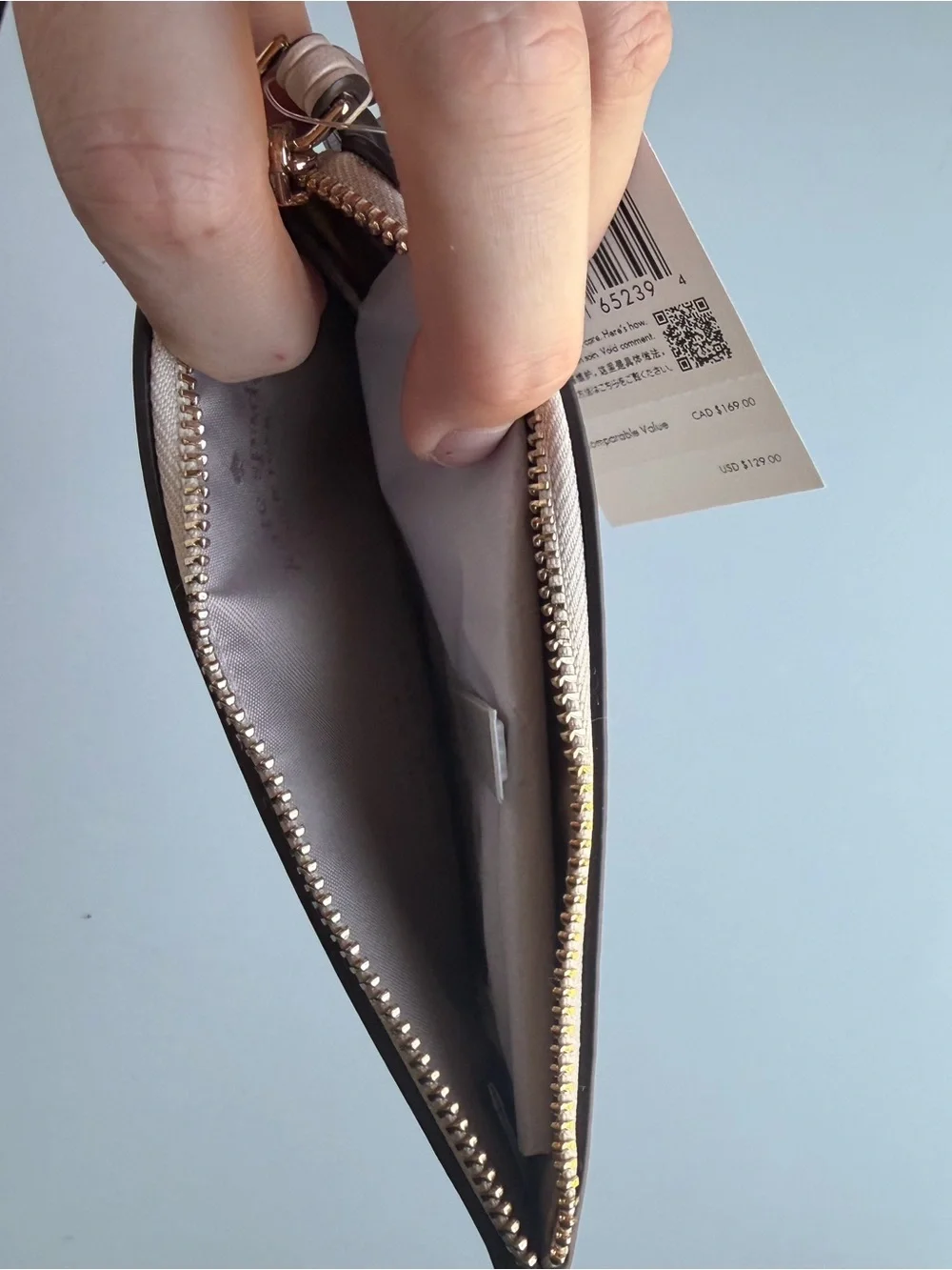 kate spade beige patterned wristlet card case with gold logo